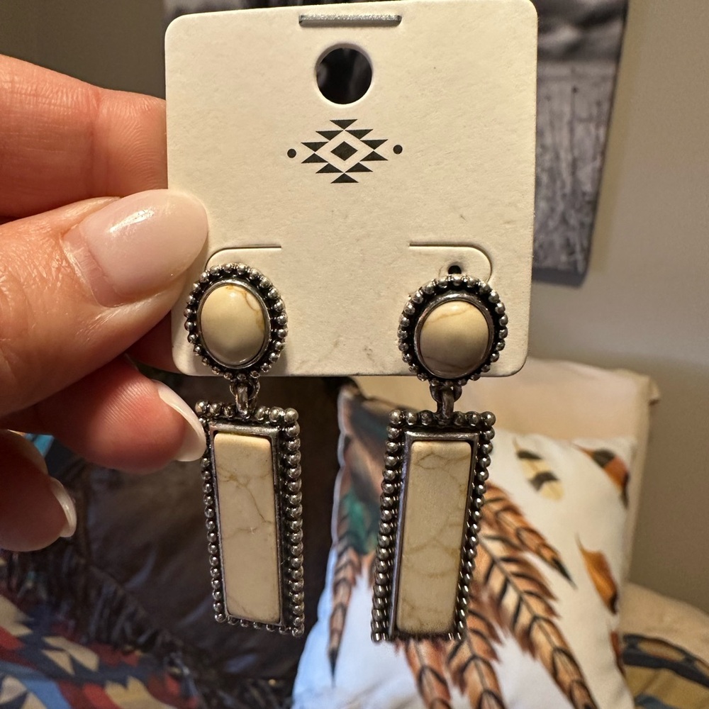 White and silver studded earrings/new